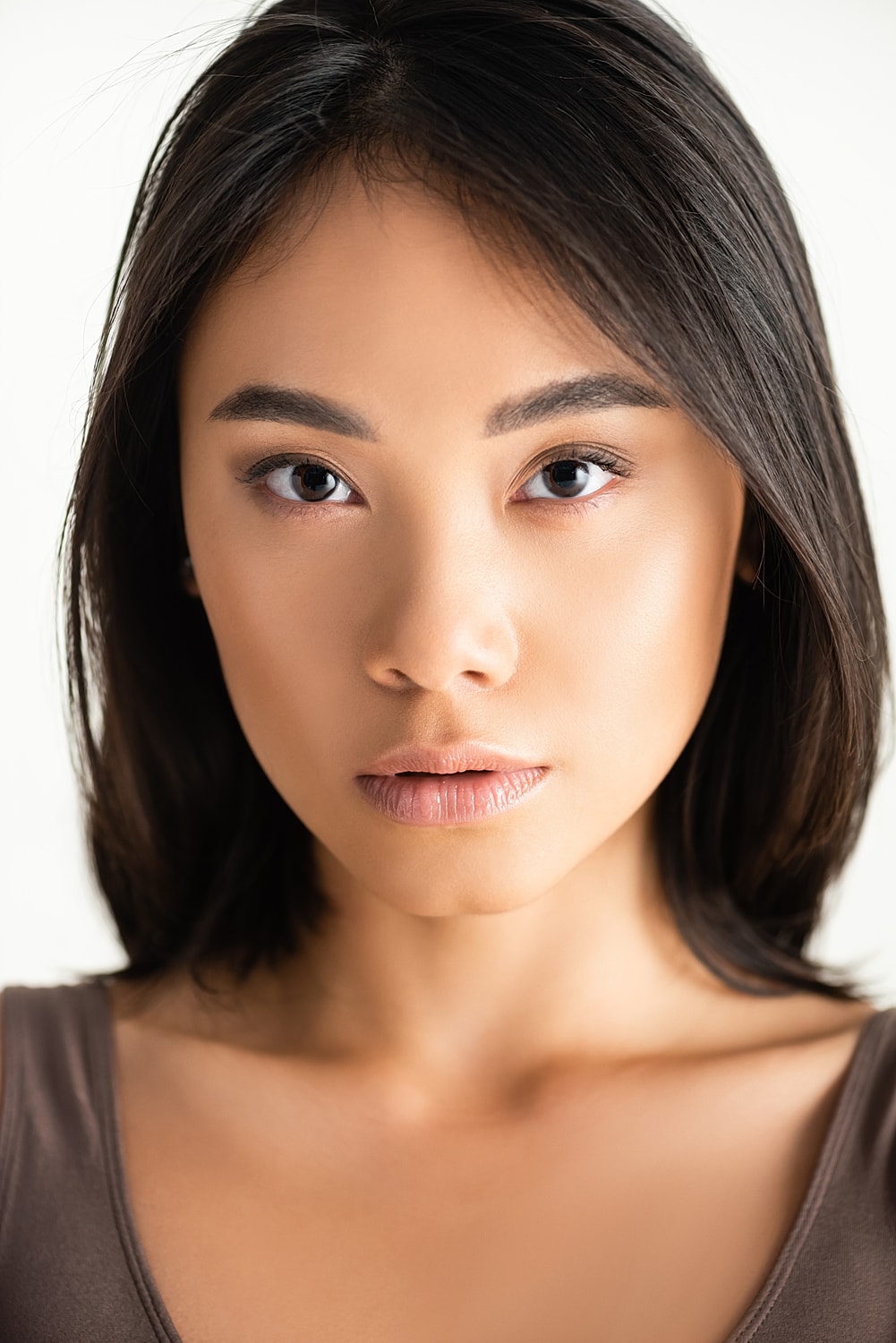Close-up of a woman’s face with natural makeup.